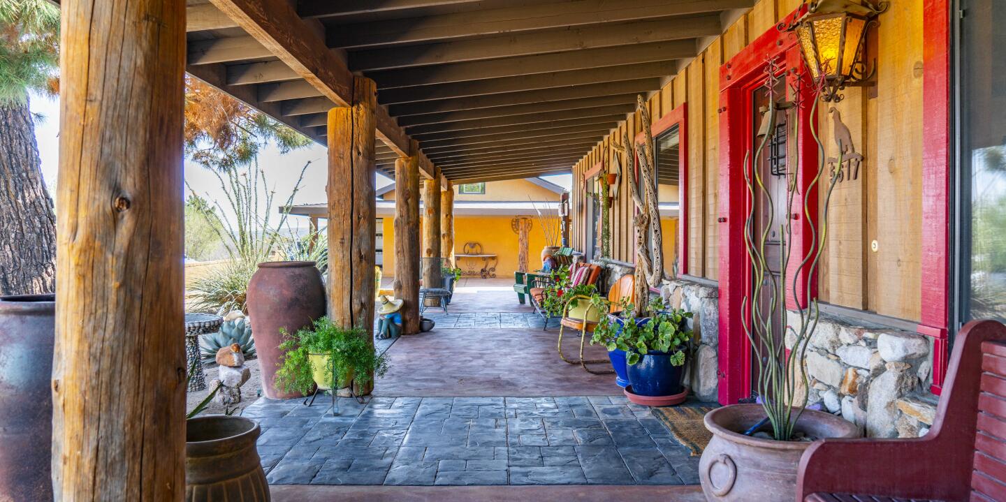 The front porch with flooring and wood materials.