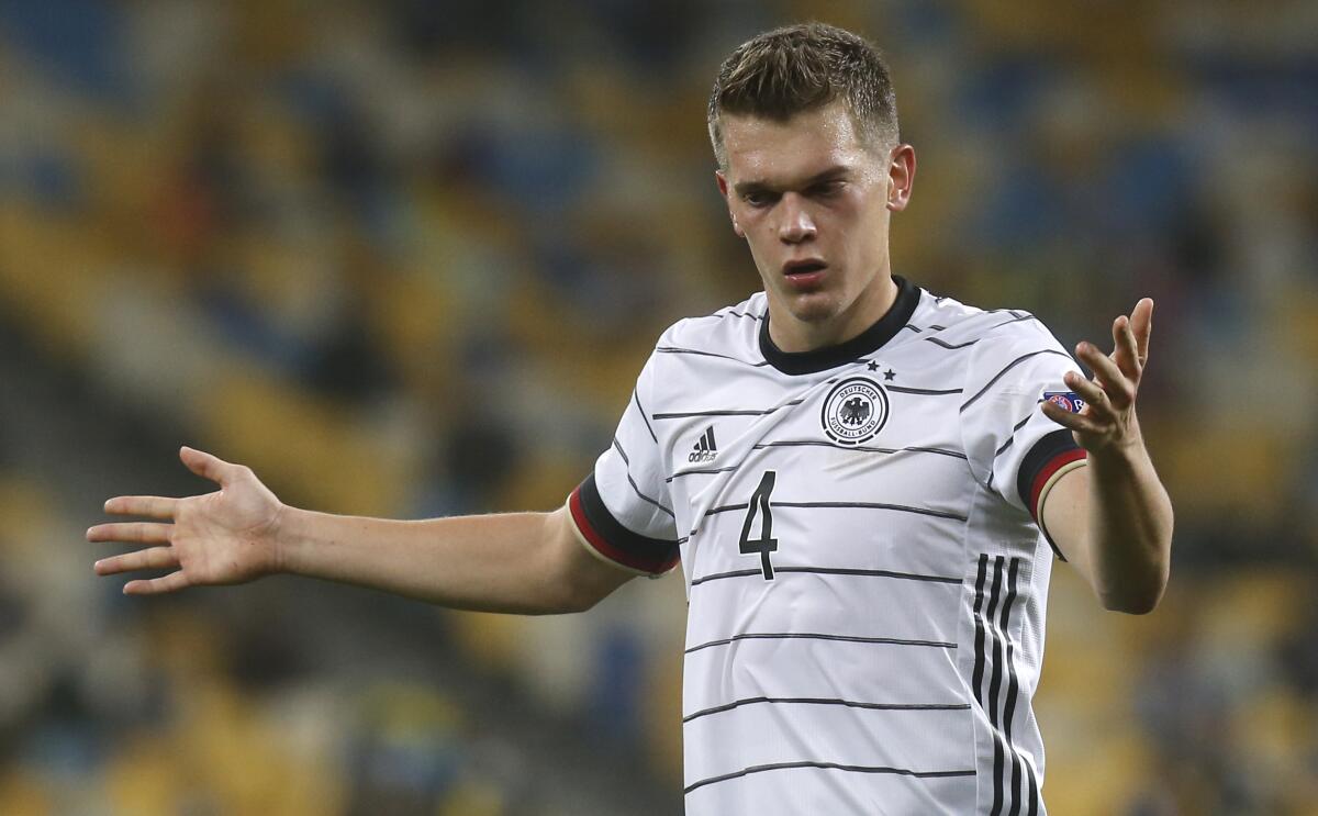 FILE - In this Saturday, Oct.10, 2020 file photo, Germany's Matthias Ginter reacts during the UEFA Nations League soccer match between Ukraine and Germany at the Olimpiyskiy Stadium in Kyiv, Ukraine. Germany's national soccer team coach Hansi Flick has included Barcelona goalkeeper Marc-Andre ter Stegen and Borussia Mönchengladbach defender Matthias Ginter to the Germany squad for its upcoming World Cup qualifiers against Romania and North Macedonia. (AP Photo/Efrem Lukatsky, File)