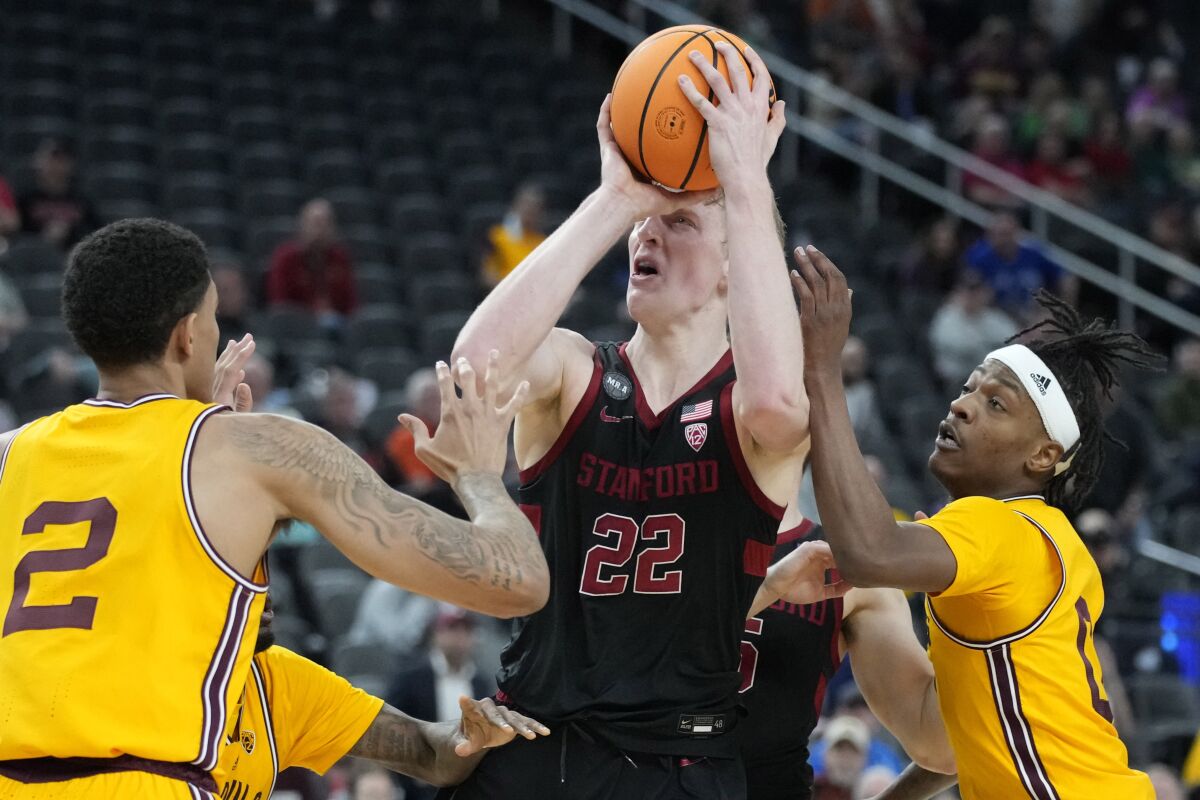 Stanford's James Keefe (22) shoots a game-winning shot against Arizona State during the second half of an NCAA college basketball game in the first round of the Pac-12 tournament Wednesday, March 9, 2022, in Las Vegas. (AP Photo/John Locher)