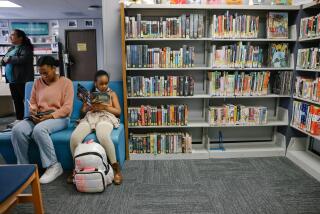 Los Angeles, CA - May 03: People utilize the space at the Ben Franklin Branch on Wednesday, May 3, 2023 in Los Angeles, CA. This year marks the 150th anniversary of the Los Angeles Public Library. (Dania Maxwell / Los Angeles Times).