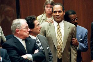 O.J. Simpson as the not guilty verdict is read 