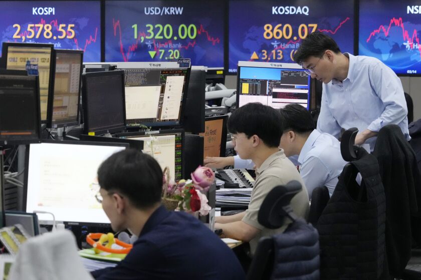 Currency traders watch monitors at the foreign exchange dealing room of the KEB Hana Bank headquarters in Seoul, South Korea, Thursday, June 1, 2023. Asian benchmarks were mostly higher Thursday after the U.S. House of Representatives approved a debt ceiling and budget cuts package, avoiding a default crisis. (AP Photo/Ahn Young-joon)