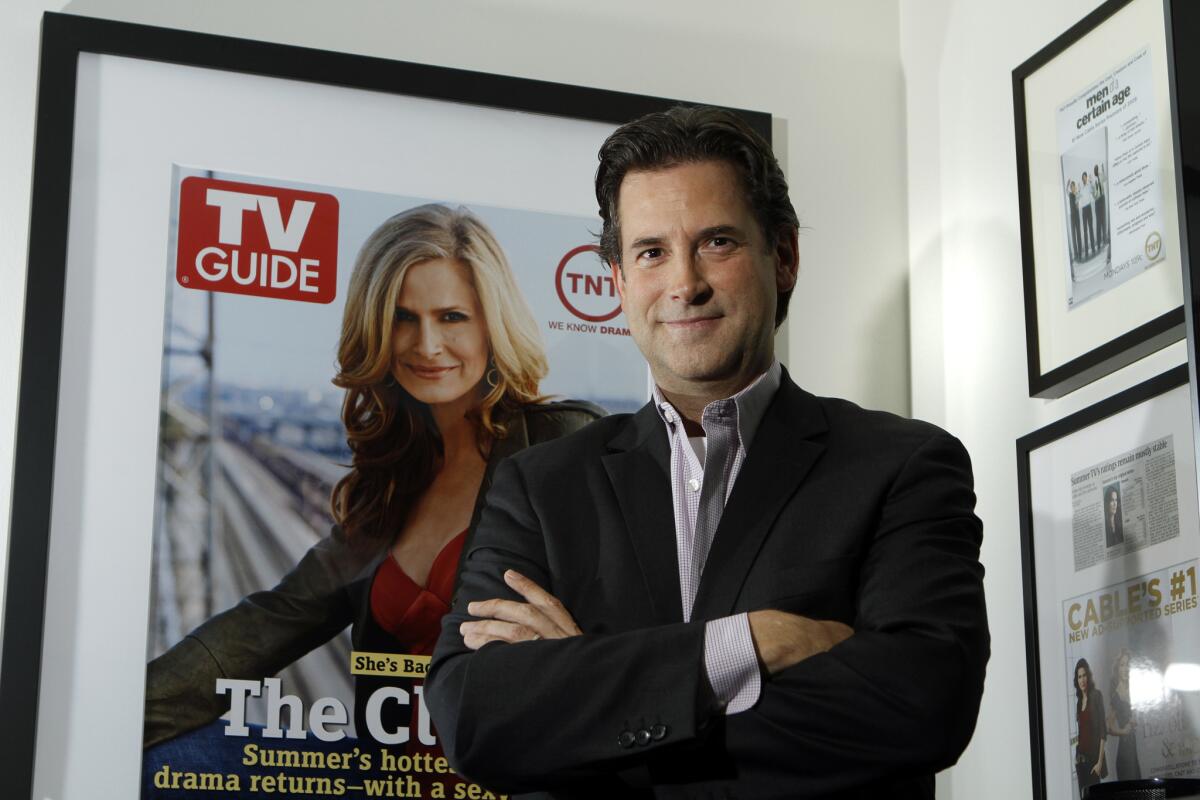 Michael Wright, programming president for Turner Broadcasting's TNT, TBS and Turner Classic Movies, is said to be stepping down. Above, Wright is shown in his Burbank office in 2010.
