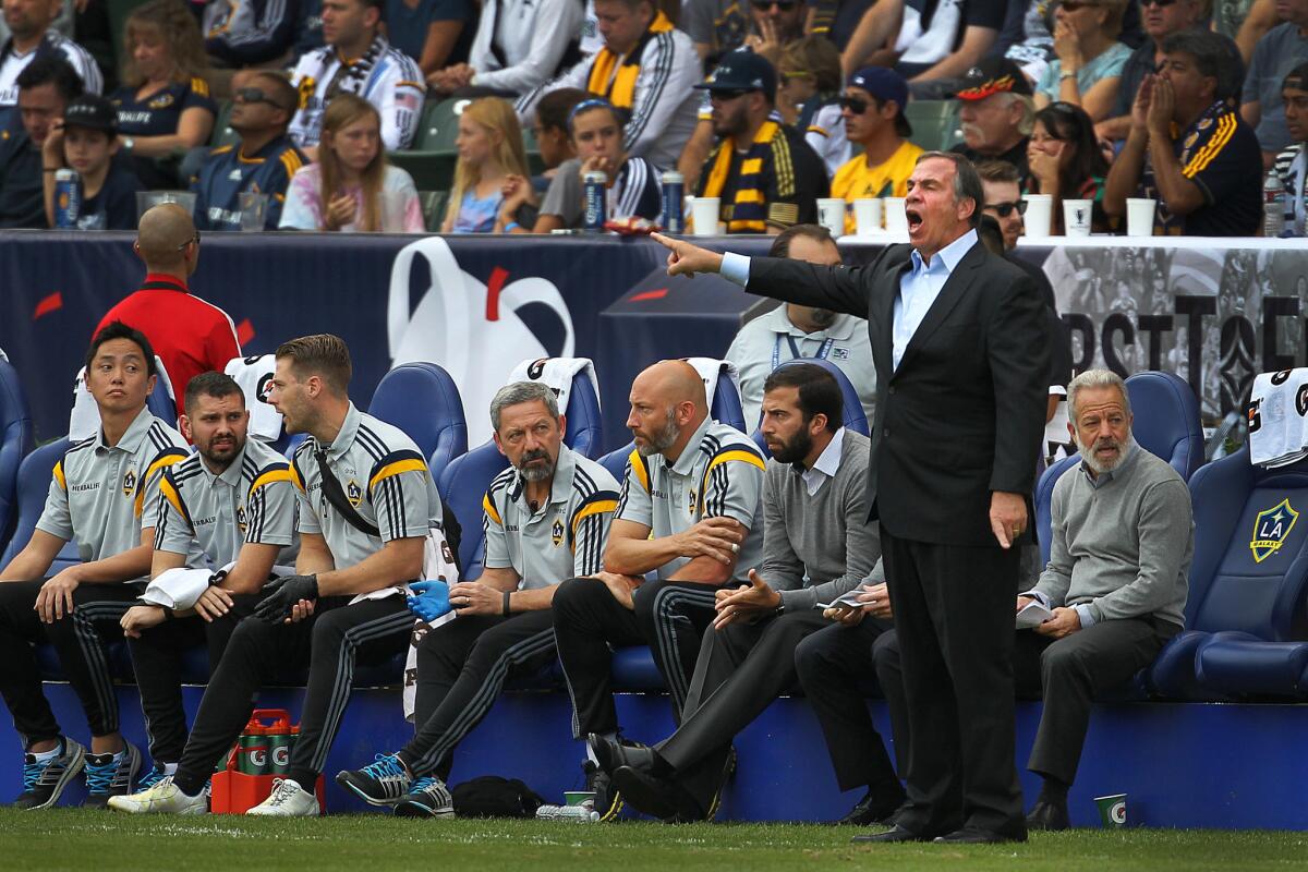 Galaxy Coach Bruce Arena gives directions to his players during their 2-1 victory over the Revolution.