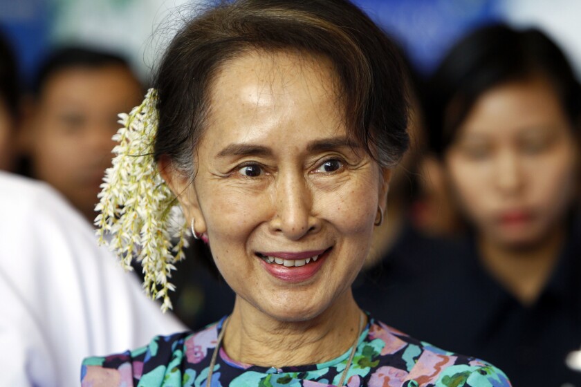 FILE - In this Dec. 14, 2018, file photo, Myanmar's deposed Leader Aung San Suu Kyi arrives to attend the Myanmar Entrepreneurship Summit at the Myanmar International Convention Center in Naypyidaw, Myanmar. The trial of Aung San Suu Kyi entered its second day Tuesday, June 15, 2021, with the prosecution presenting arguments that she incited public disorder and flouted coronavirus restrictions, part of a package of charges the ruling junta is seen as using to discredit her and consolidate its control. (AP Photo/Aung Shine Oo, File)