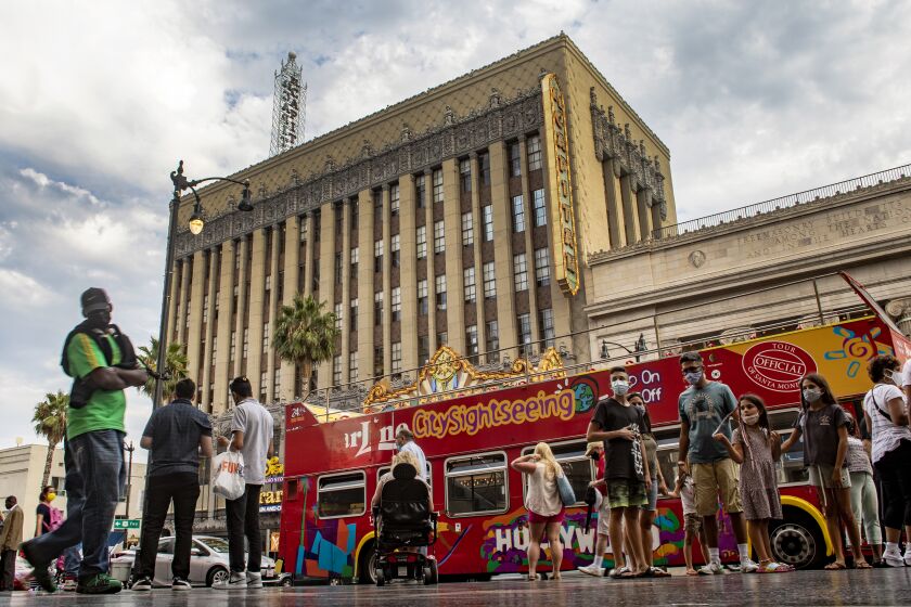 LOS ANGELES, CA - AUGUST 11, 2021: Despite the Delta variant, tourists are still flocking to Hollywood Boulevard to check out the Walk of Fame and other iconic sites on August 11, 2021 in Los Angeles, California.(Gina Ferazzi / Los Angeles Times)