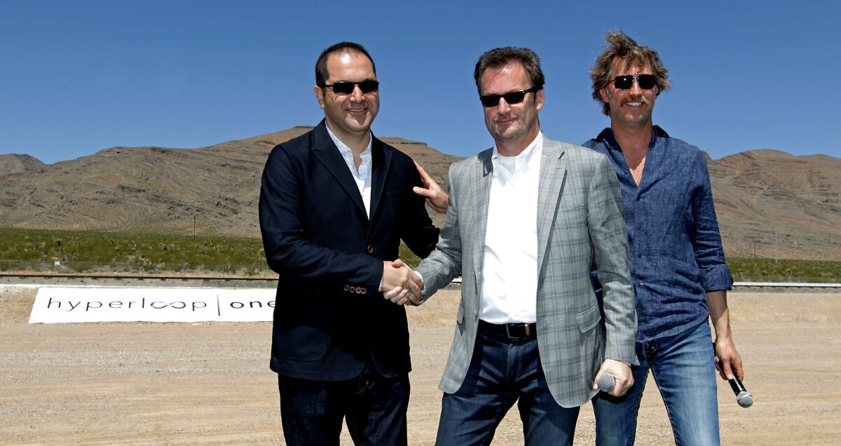 From left, Hyperloop Technologies co-founder Shervin Pishevar, Chief Executive Rob Lloyd and Brogan BamBrogan at a test of the firm's propulsion system in Nevada before BamBrogan left the company.