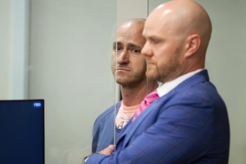 Joseph David Emerson, left, 44, was arraigned in Multnomah County Circuit Court on Tues., Oct. 24, 2023, in Portland, Ore. Emerson, a pilot, is accused of attempting to disable the engines of a plane on which he was riding while off-duty last Sunday. Emerson pleaded not guilty Tuesday. (Dave Killen/The Oregonian via AP, Pool)