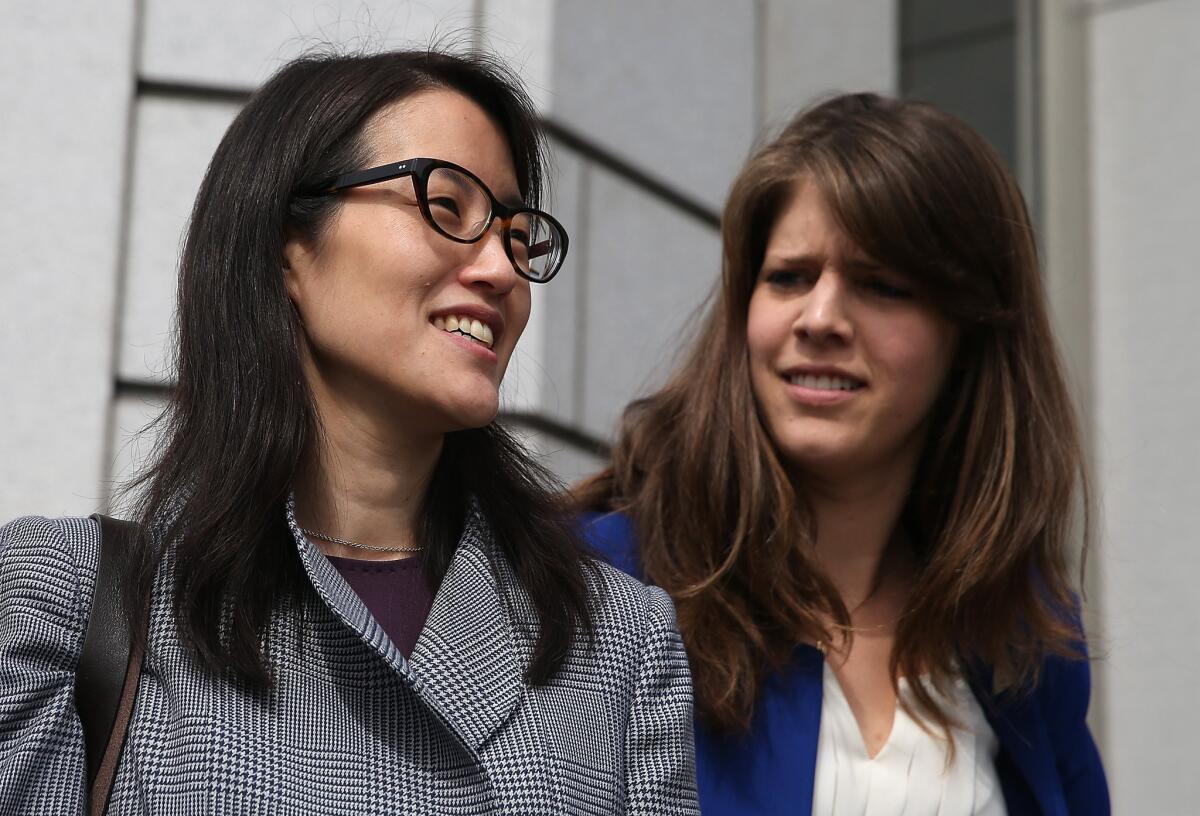 Ellen Pao, left, leaves the California Superior Court Civic Center Courthouse in San Francisco during a lunch break from her trial on March 10.