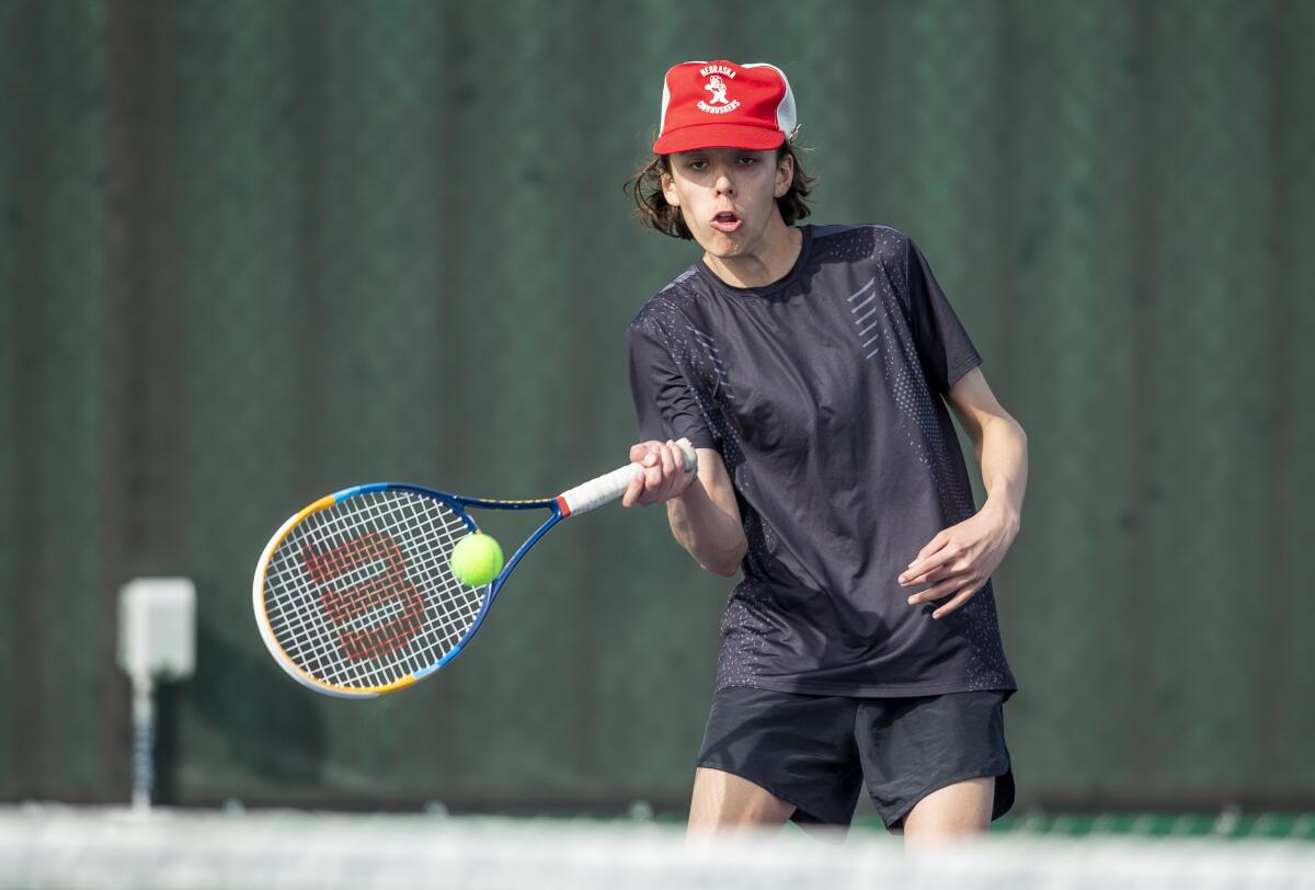 Estancia's Jackson Long returns a forehand during a Battle for the Bell match at Costa Mesa High School on Tuesday.