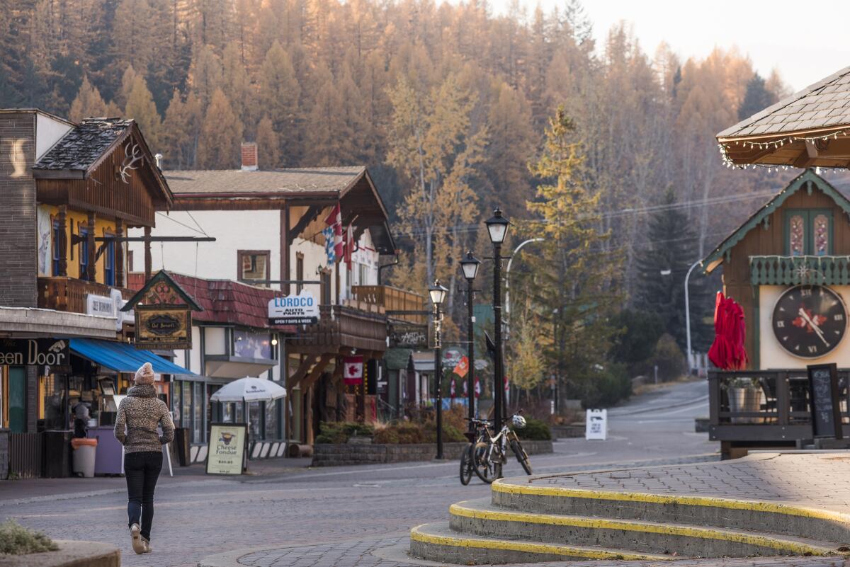 A woman walks through the former mining town of Kimberley, British Columbia, now an outdoorsy destination for winter sports.