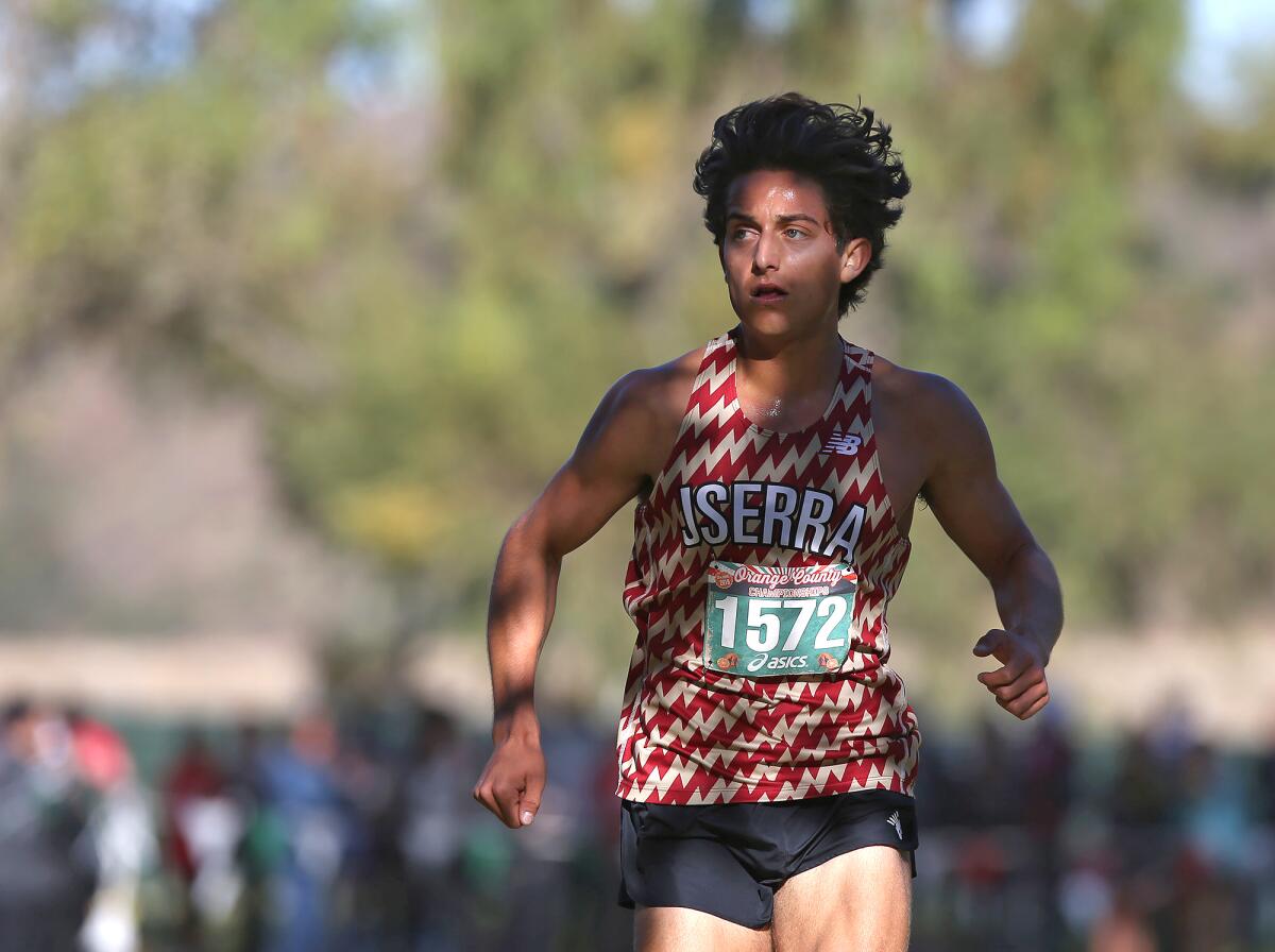 JSerra's Anthony Grover leads the pack in the boys' sweepstakes race of the Orange County Cross-Country Championships at Oak Canyon Park on Saturday.