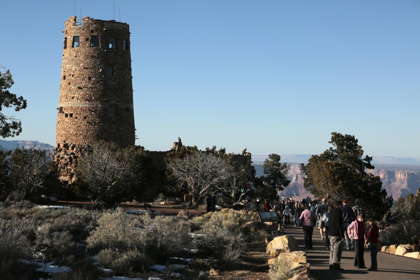 Visitors to the South Rim of the Grand Canyon take a break from hiking trails to explore the Desert View Watchtower.