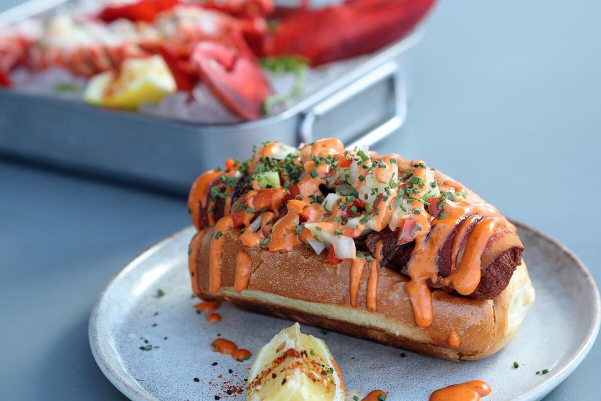 A bacon-wrapped lobster dog at the recently opened Calico Fish House in Sunset Beach.