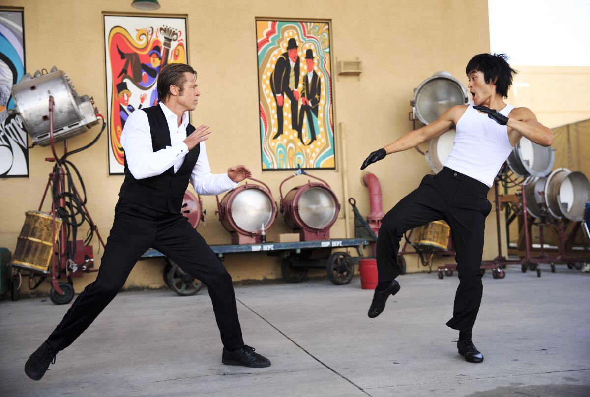 Brad Pitt, left, and Mike Moh play Cliff Booth and Bruce Lee in "Once Upon a Time … in Hollywood."