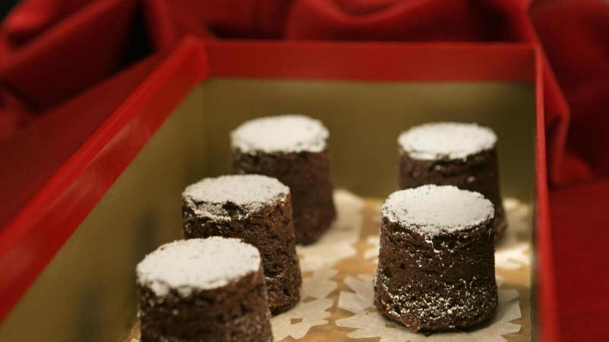 Thomas Keller's chocolate bouchons have a texture somewhere between dense cake and denser brownies. Recipe: Chocolate bouchons