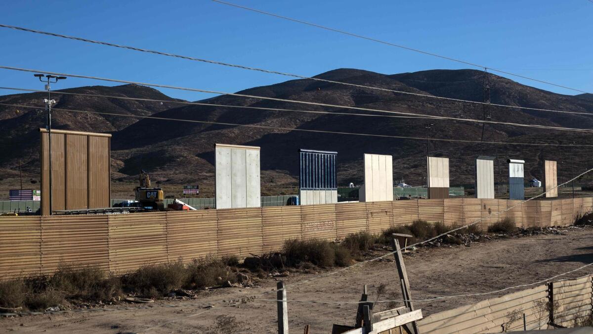 Eight prototypes of President Trump's proposed border wall are seen from Tijuana, Mexico, on Oct. 22.