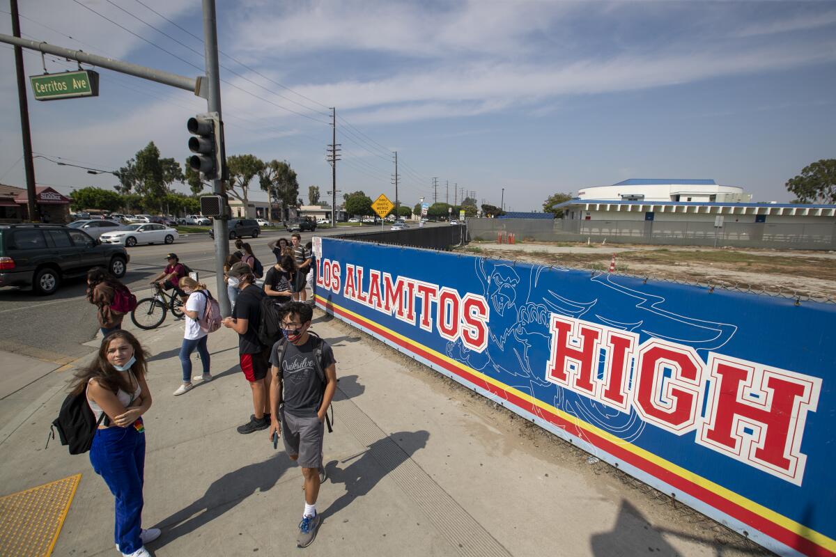 Students leave campus after a day of in-class learning at Los Alamitos High School.