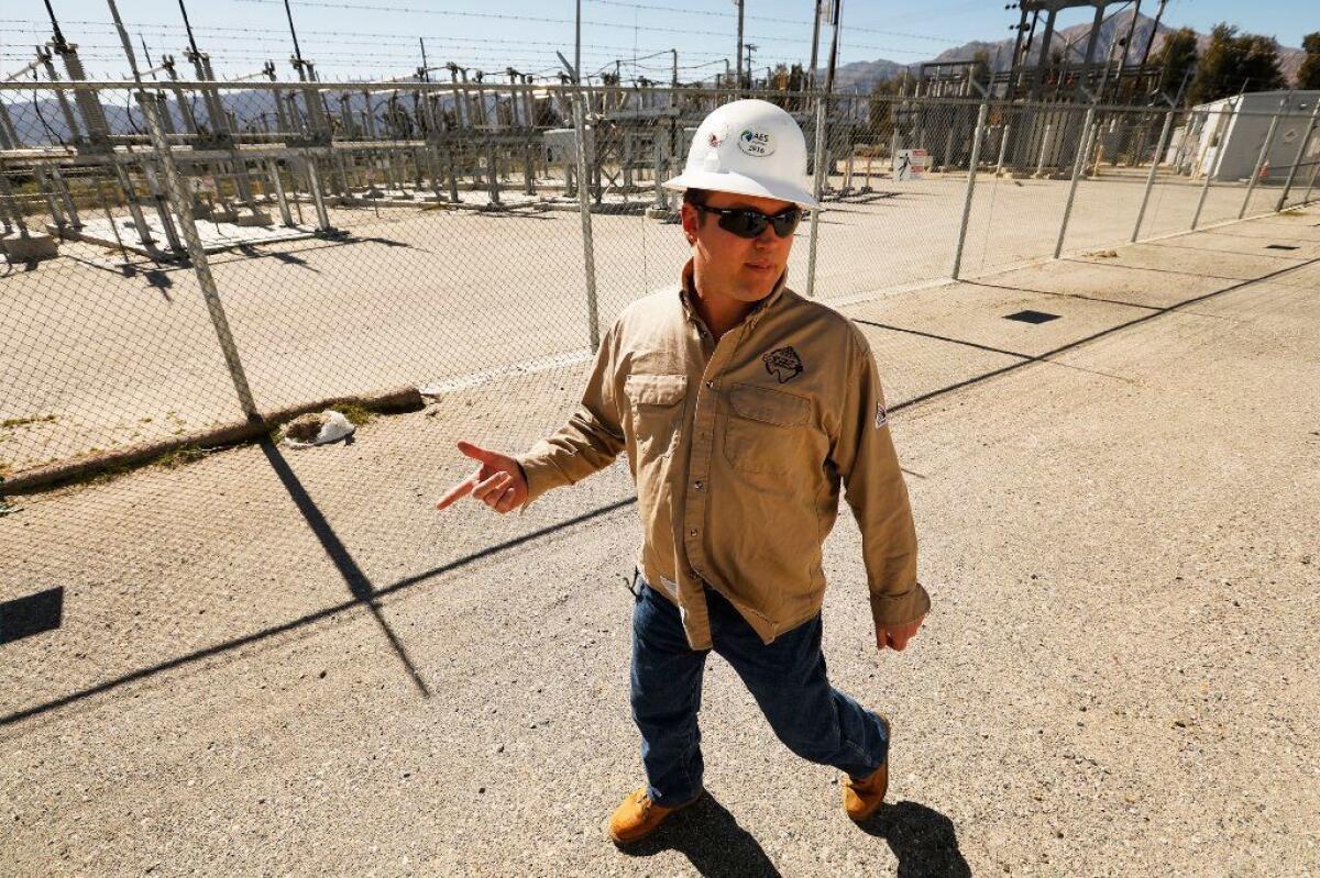 SDG&E engineer Steven Prsha walks past a substation next door to the utility's microgrid in Borrego Springs, in the desert of eastern San Diego County.