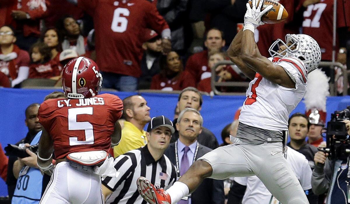Ohio State wide receiver Michael Thomas makes a touchdown catch along the side of the end zone against Alabama defensive back Cyrus Jonesin the first half of the Sugar Bowl on Thursday night in New Orleans.