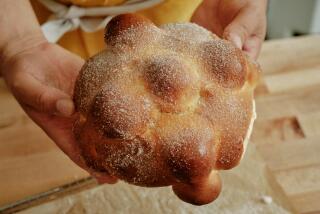 LONG BEACH, CA - SEPTEMBER 30: Gusto Bread Owner Arturo Enciso makes pan de muerto, a sweet, seasonal bread that coincides with the Dia de los Muertos holiday, at Gusto Bread on September 30, 2024 in Long Beach, CA. (Shelby Moore / For The Times)