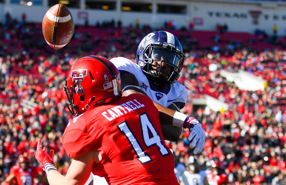 TCU's Jeff Gladney, top, knocks a pass away from Texas Tech's Dylan Cantrell.