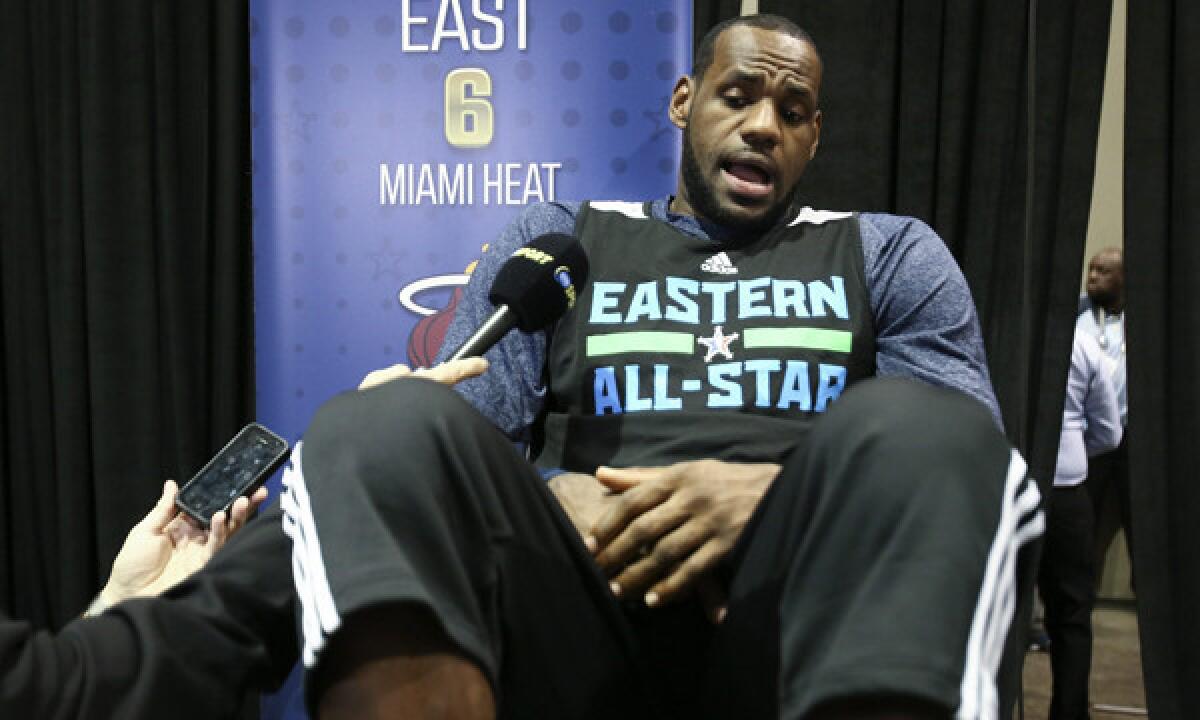 Miami Heat star LeBron James answers questions during activities Saturday ahead of Sunday's NBA All-Star Game in New Orleans.