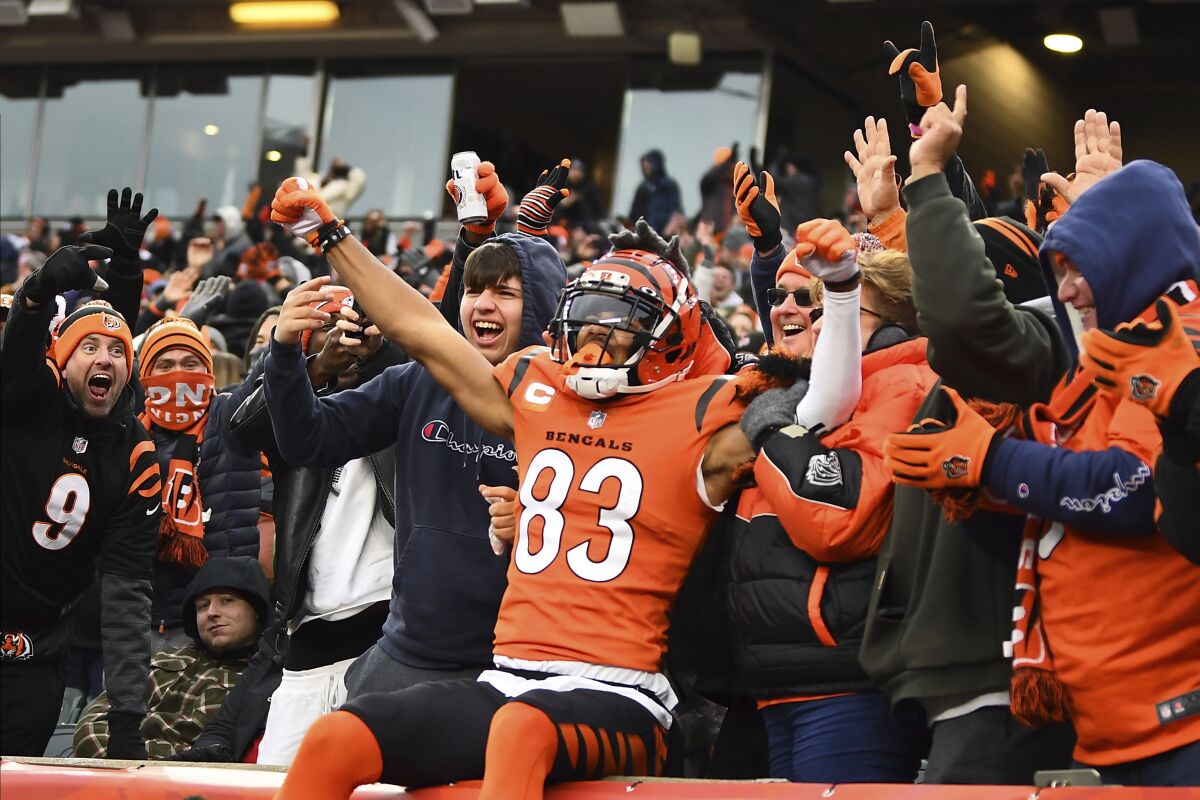 Cincinnati Bengals wide receiver Tyler Boyd (83) celebrates a touchdown with fans.