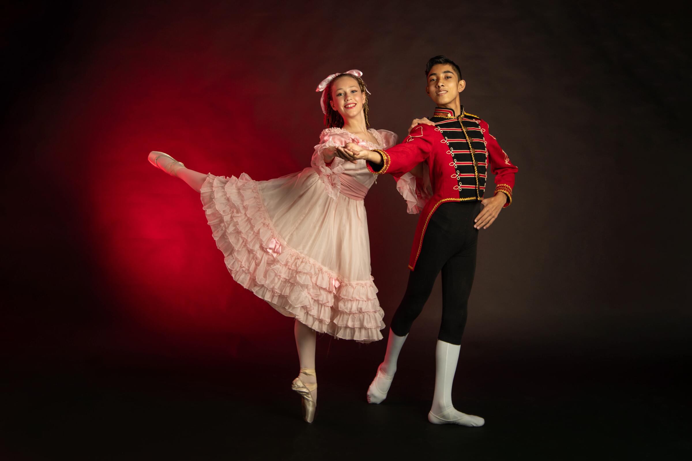 Young girl and boy ballet dancers dressed in costume