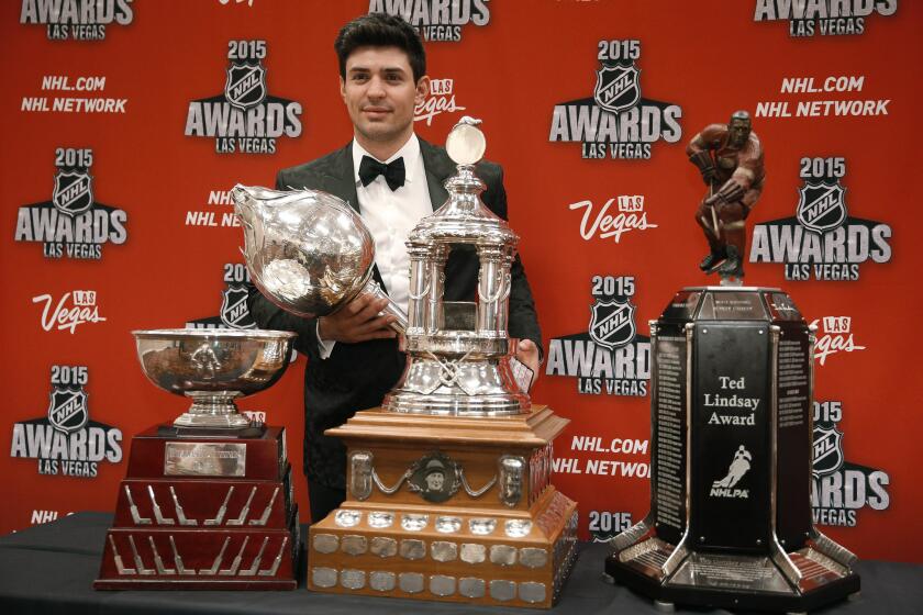 Montreal Candiens goaltender Carey Price poses with the William M. Jennings trophy, the Vezina Trophy, the Ted Lindsay Award trophy and the Art Ross trophy.