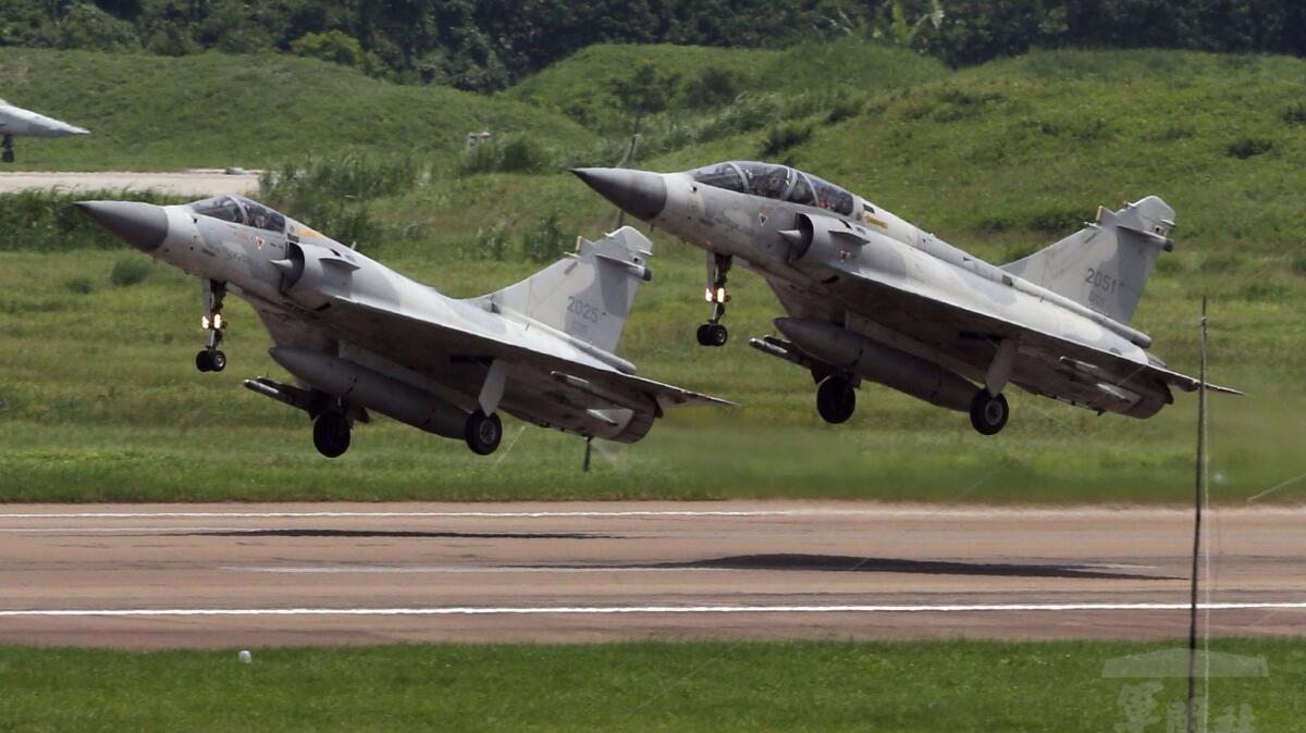 Two Taiwan Mirage 2000-5 jets take off for a training flight from Hsinchu Airbase in Hsinchu, western Taiwan, on June 18, in this handout photo made available by the Taiwan Military News Agency on Nov. 7.