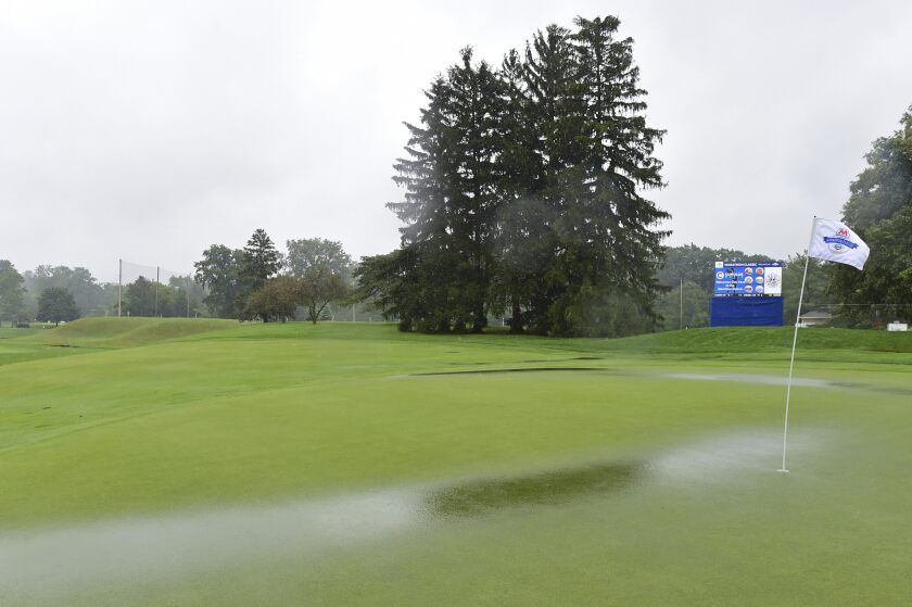 Water pools on the green of the ninth hole as play is suspended during the final round of the Marathon LPGA Classic golf tournament at Highland Meadows Golf Club in Sylvania, Ohio, Sunday, July 11, 2021, in Sylvania, Ohio. (AP Photo/David Dermer)