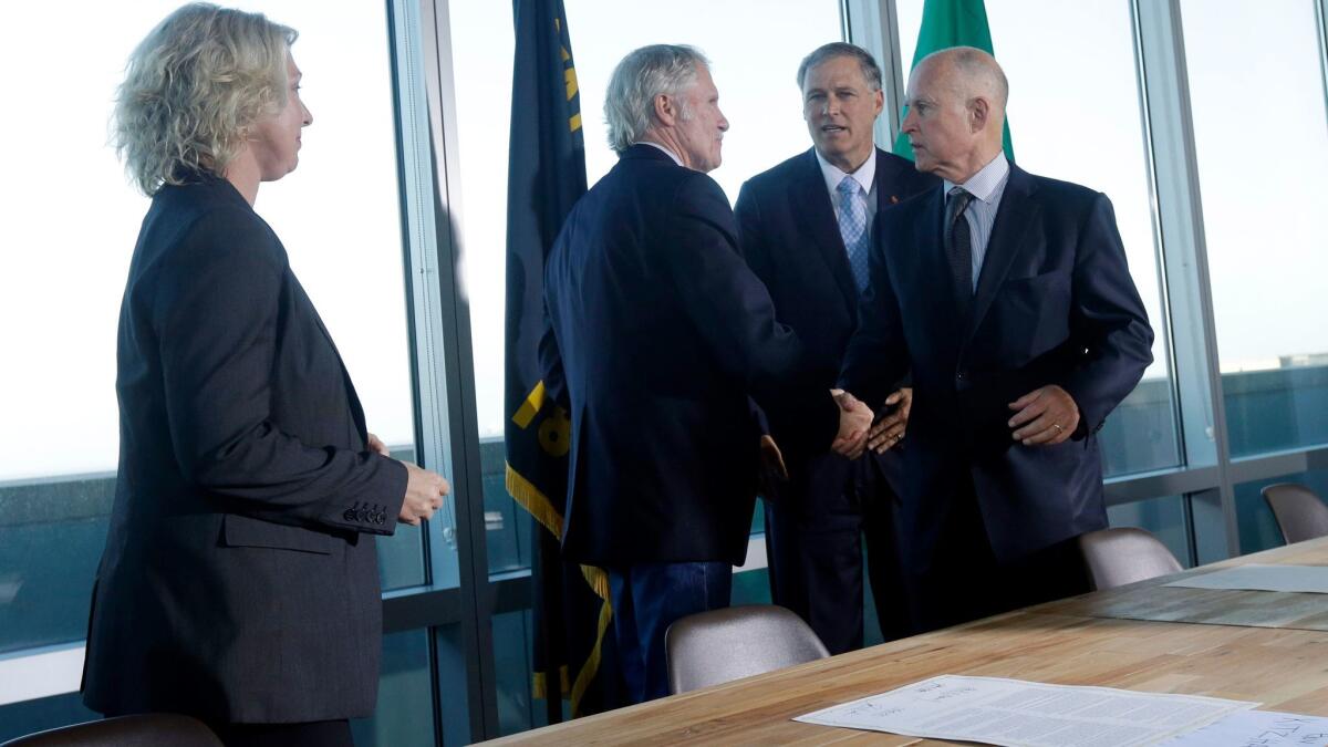 Gov. Brown, right, with the Washington and Oregon governors and the British Columbia environment minister after signing a 2013 climate accord in San Francisco.