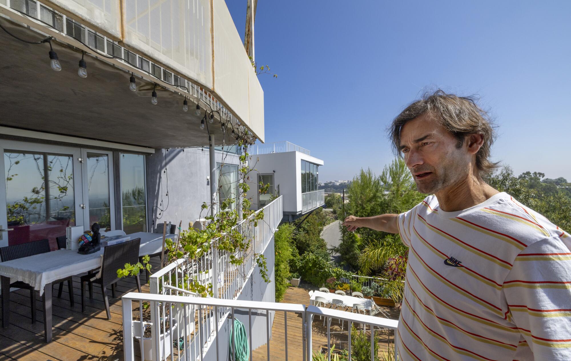 Sascha Jovanovic explains his situation on the deck of his Los Angeles home.