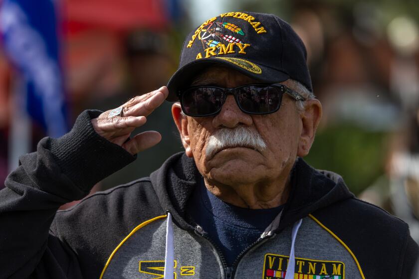 SAN GABRIEL, CA - NOVEMBER 10: Leroy Morales, 80, a Vietnam War veteran, salutes during a Veterans Day ceremony at Plaza Park on Friday, Nov. 10, 2023 in San Gabriel, CA. (Irfan Khan / Los Angeles Times)