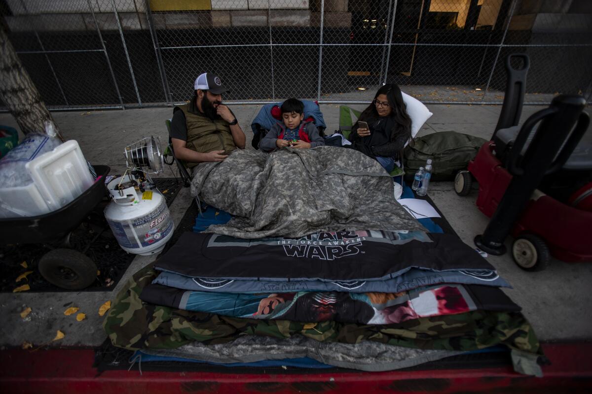 People camp out along the Rose Parade route