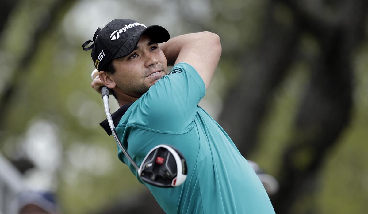 Jason Day watches his tee shot on the first hole during round-robin play against Graeme McDowell at the Dell Match Play Championship golf tournament on Wednesday.