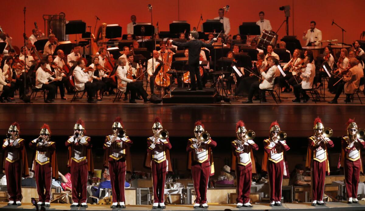 The USC marching band, adding its pomp to the annual program. (Francine Orr / Los Angeles Times)