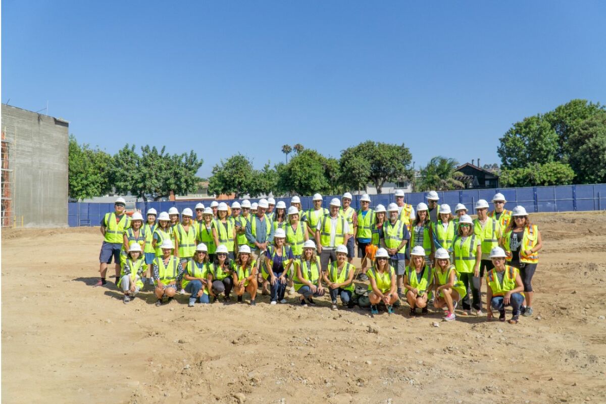 PB Middle School’s teachers and staff on the site of the future two-story, 26-classroom building, to be completed next year. It will replace the old administrative and classroom buildings, built in the early 1950s.