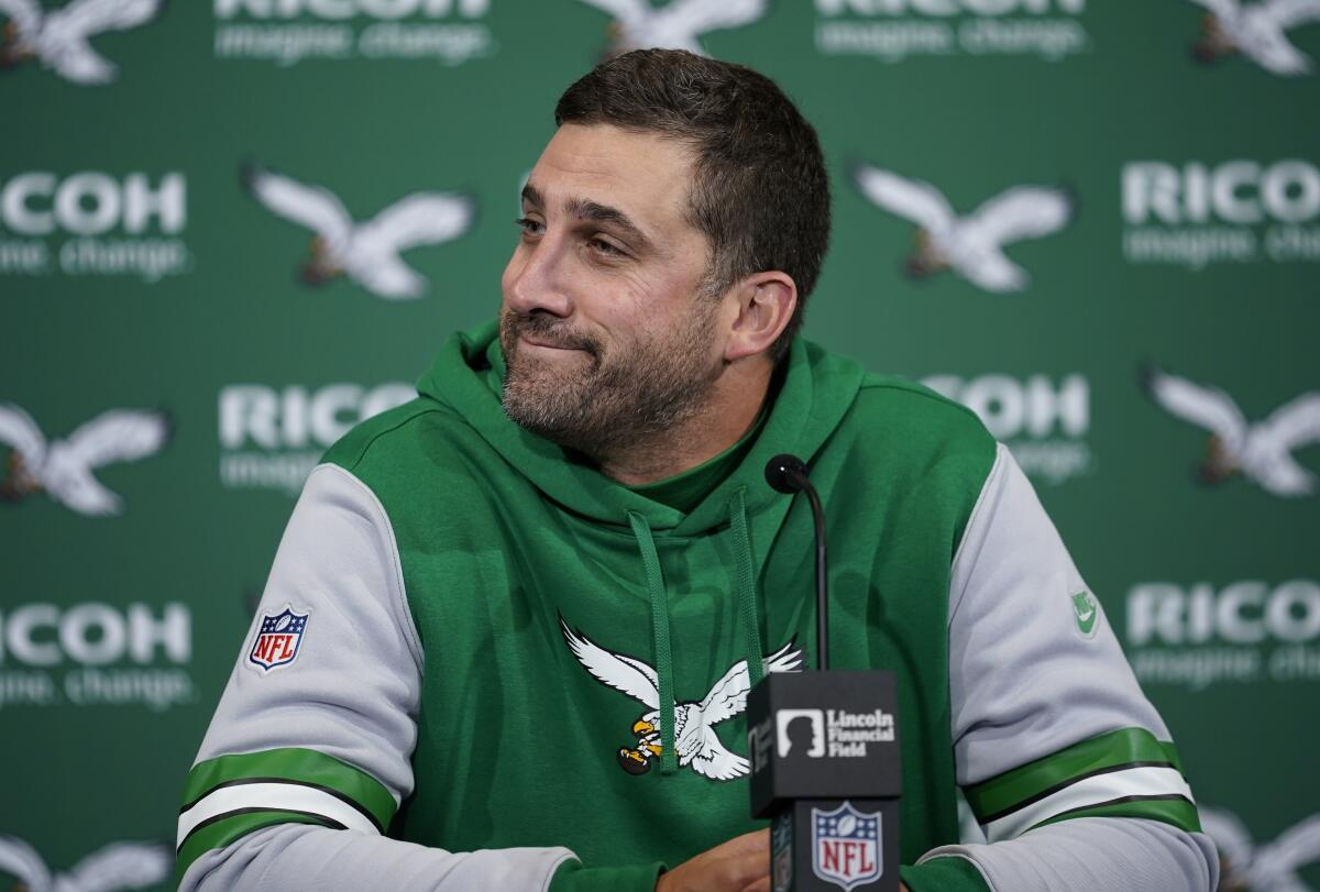 Eagles coach Nick Sirianni smirks to his right while speaking during a news conference after a game against the Dolphins.
