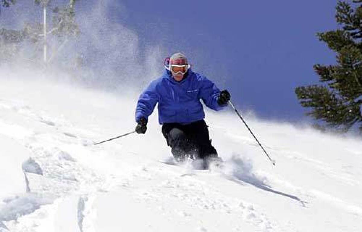 Dana Merryman skis fresh powder the day after a big storm at Donner Ski Ranch.