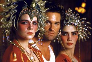 Actor Kurt Russell, center, and actresses Kim Cattrall, right, and Suzee Pai in "Big Trouble in Little China."