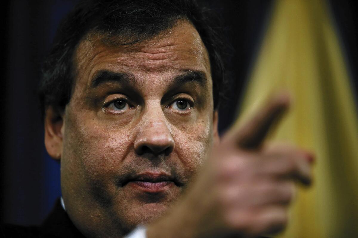 New Jersey Gov. Chris Christie gestures during a news conference Thursday in Trenton. Christie fired a top aide who engineered political payback against a town mayor, saying she lied.