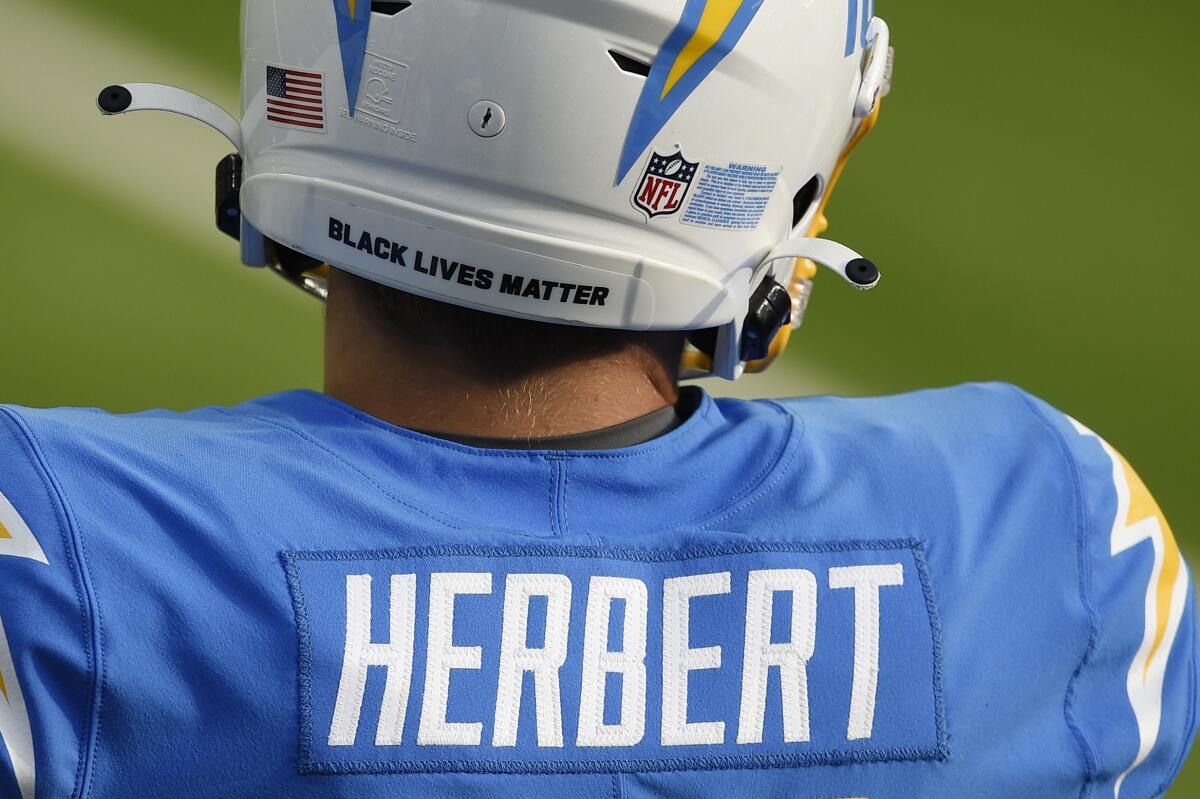 Closeup of the back of Los Angeles Chargers quarterback Justin Herbert in uniform