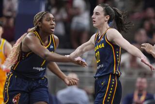 Indiana Fever guard Caitlin Clark (22) is congratulated by Aliyah Boston (7) and Kelsey Mitchell (0) 