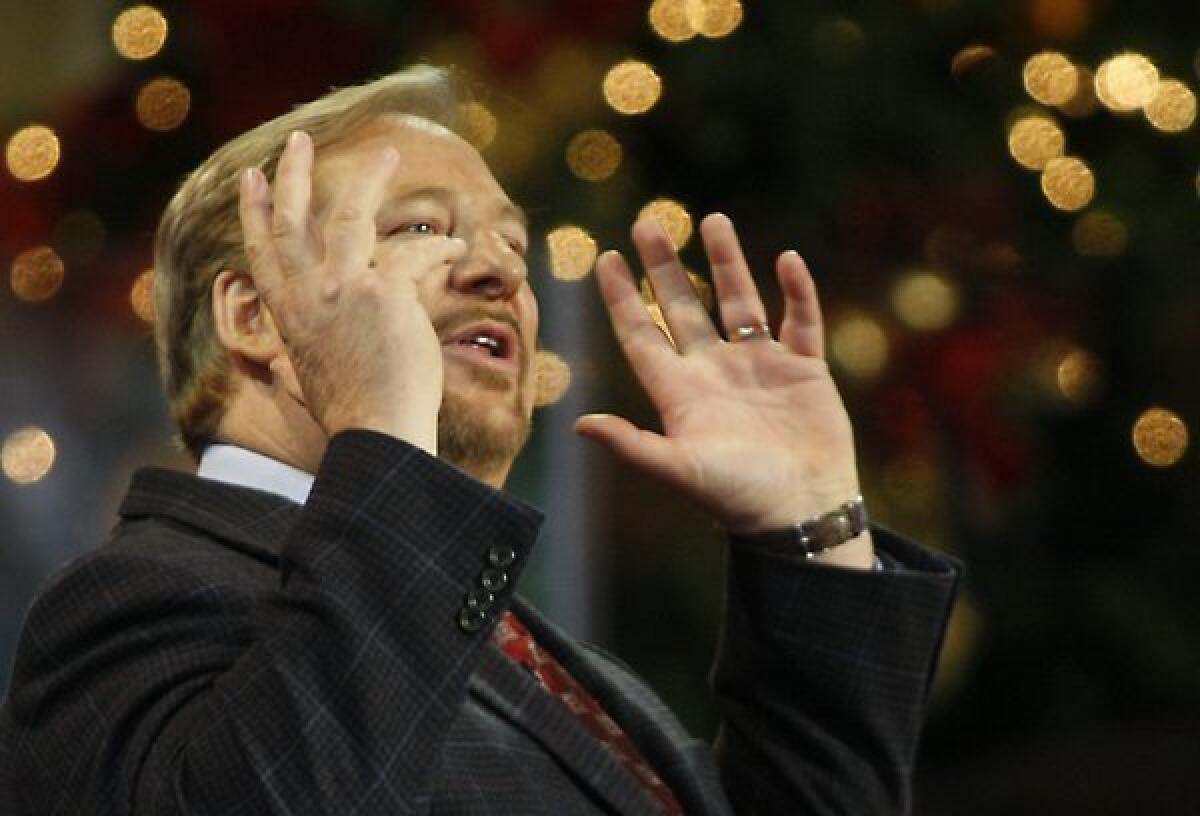 Rick Warren, pastor of Saddleback Church in Lake Forest, released a statement saying his youngest son committed suicide. Above, Warren leads Christmas Eve services in 2008.