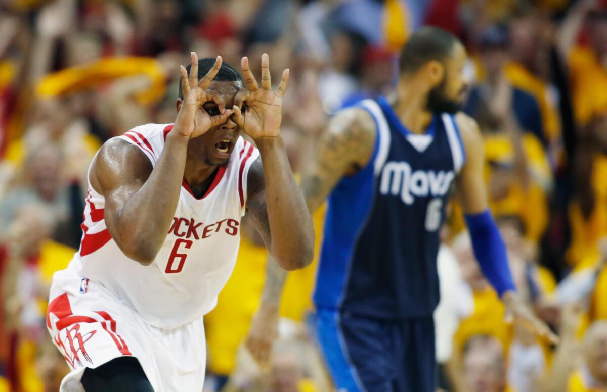 Houston forward Terrance Jones celebrates a late three against Dallas on Tuesday in the Rockets' 103-94 playoff series winning victory.