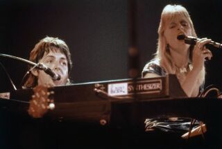 FILE - This is a May 24, 1976 file photo of Ex-Beatle Paul McCartney with his late wife, Linda, as they perform in the band Wings, at Madison Square Garden, New York. "Rockshow," the 1980 concert film of Wings' 1975 and '76 world tour, is being re-released and will be shown in four San Diego County theaters (and one in Temecula), starting May 21.