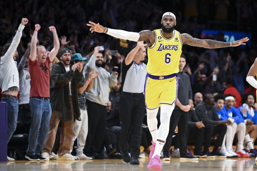 LeBron James celebrates after a shot to become the all-time NBA scoring leader