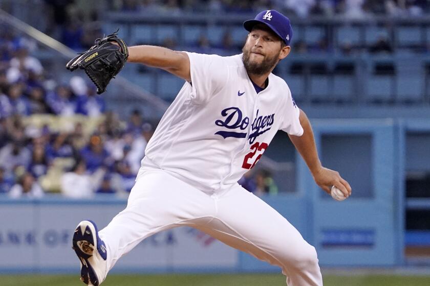 Los Angeles Dodgers starting pitcher Clayton Kershaw throws to the plate during the first inning.